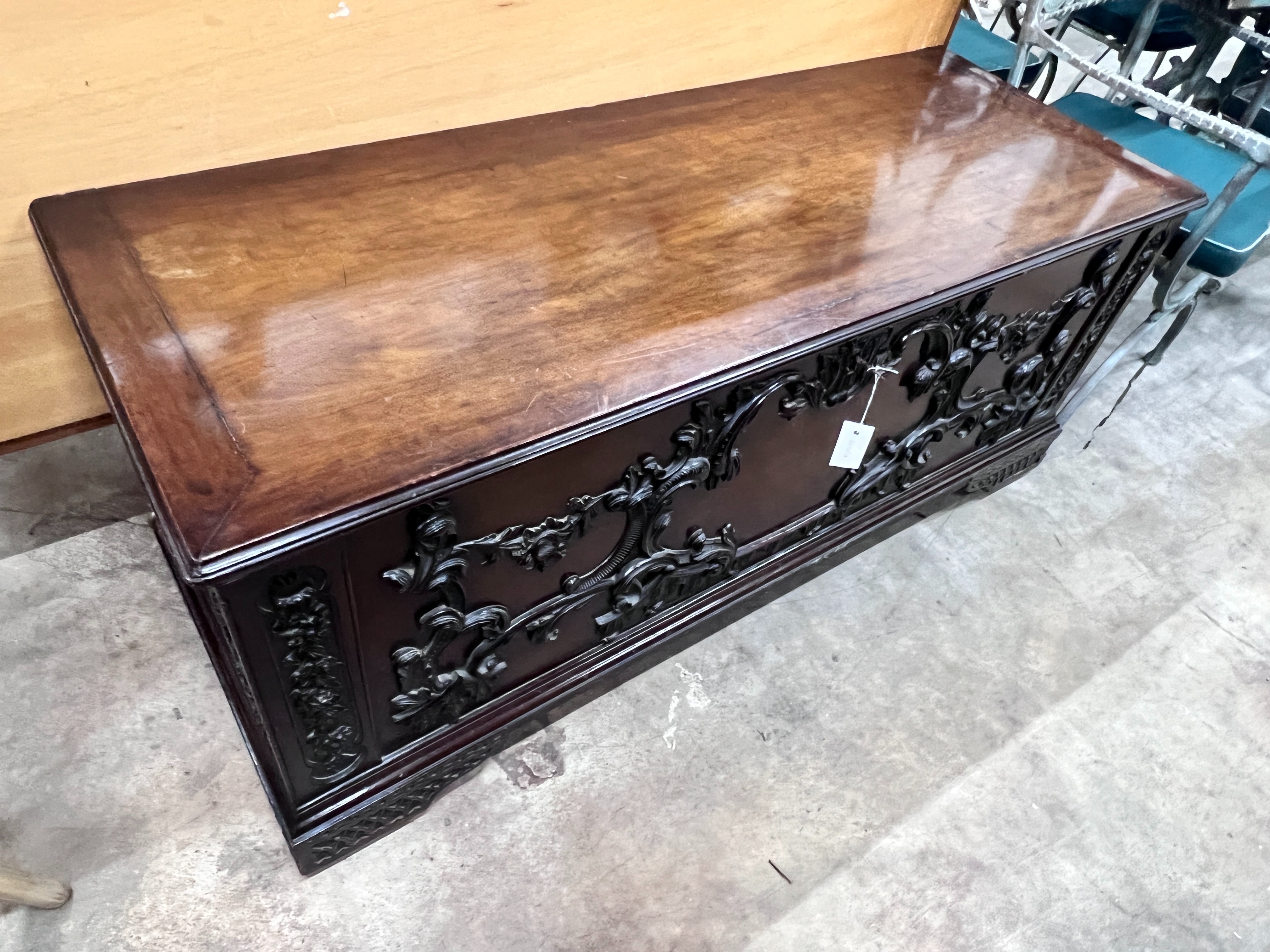 An 18th century style walnut coffer with carved applied front, width 140cm, depth 53cm, height 49cm